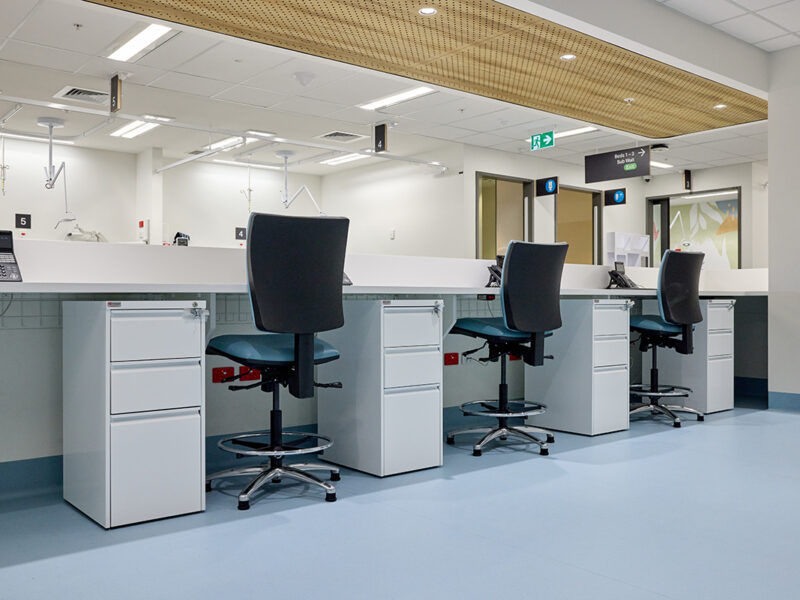 Row of office storage including stainless steel mobile pedestals